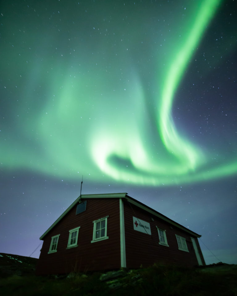 Aurora swirling over one of the cabins © William Copeland"