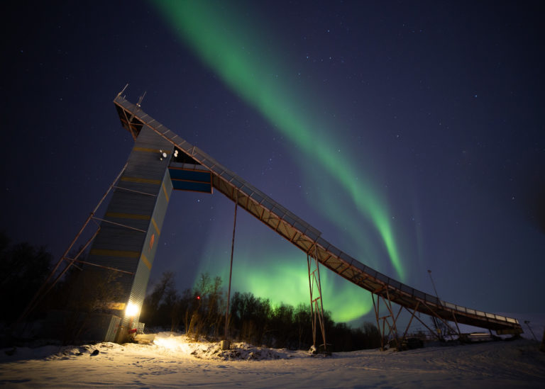 The largest ski jump with northern lights to the north © William Copeland