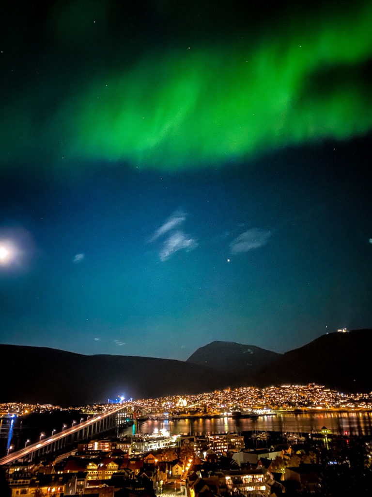 Tromsø city view with lights above from phone camera © Knut Hansvold