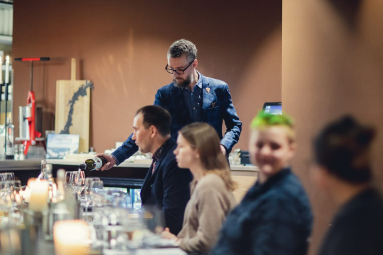 Conversing full of anticipation in the sleek, modern interiors of Mathallen © Mathallen Tromsø