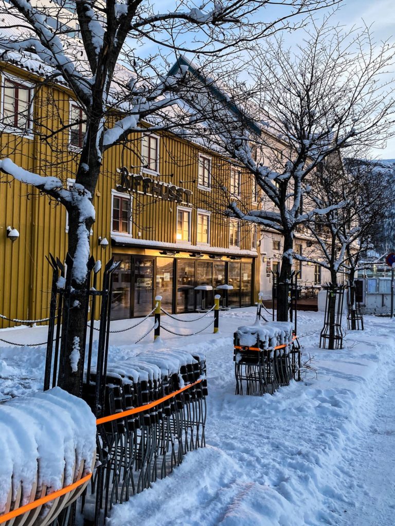 Winter at Strandtorget. The February sun is reflected in the windows of Biffhuset, an old wharf building from the 1820ies © Knut Hansvold