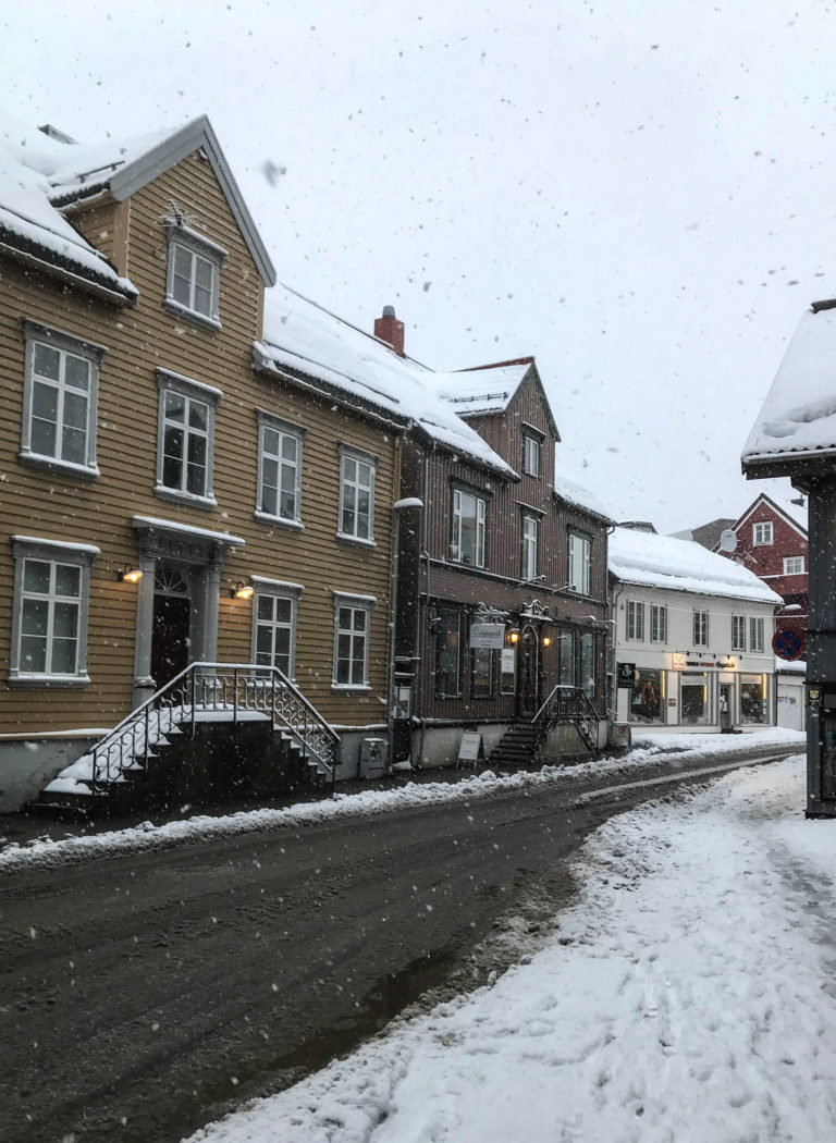 The Sjøgata street was the first main street of Tromsø. The upper row constist of merchant residences, the lower of warehouses built on stilts out into the water. The street itself was the shoreline from the founding year of 1794 © Knut Hansvold