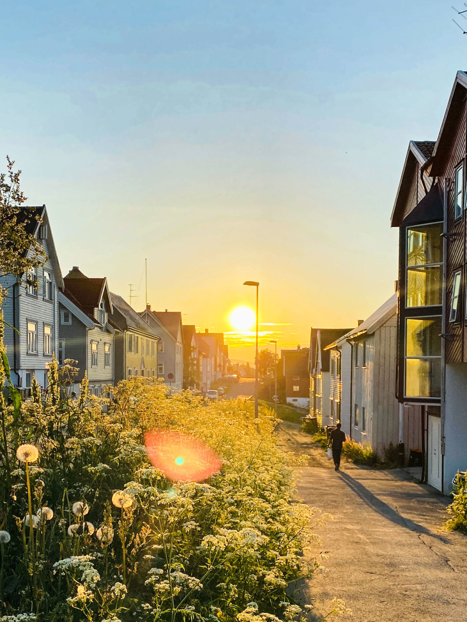 It's 2 AM on a summer night, and the sun casts light and shadows on the houses from around 1920 in Fogd Drejers gate, north in Tromsø's city centre © Knut Hansvold