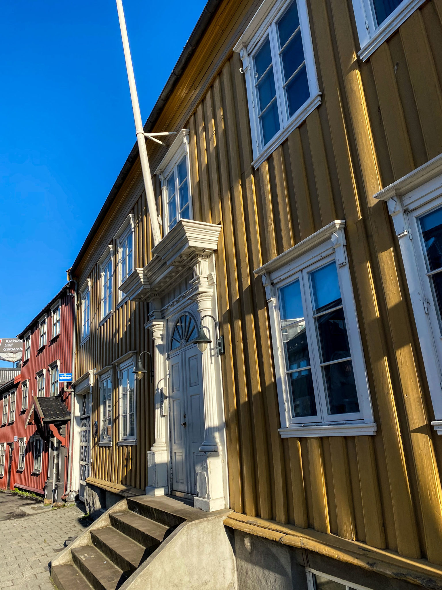 Skippergata 19 dates back to 1838 and features a symmetrical facade with an impressive portal. Be sure to cross the street to see it from a distance © Knut Hansvold